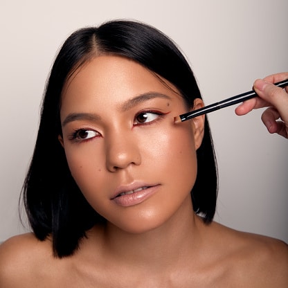 Young beautiful woman with brush for eyes, makeup beauty portrait